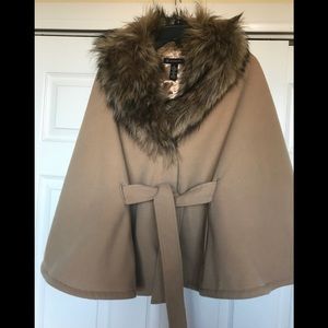 Make a statement in this camel fur trimmed cape